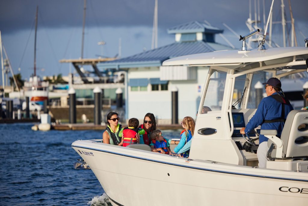 People on a boat wearing lifejackets, avoid drinking and boating concept.