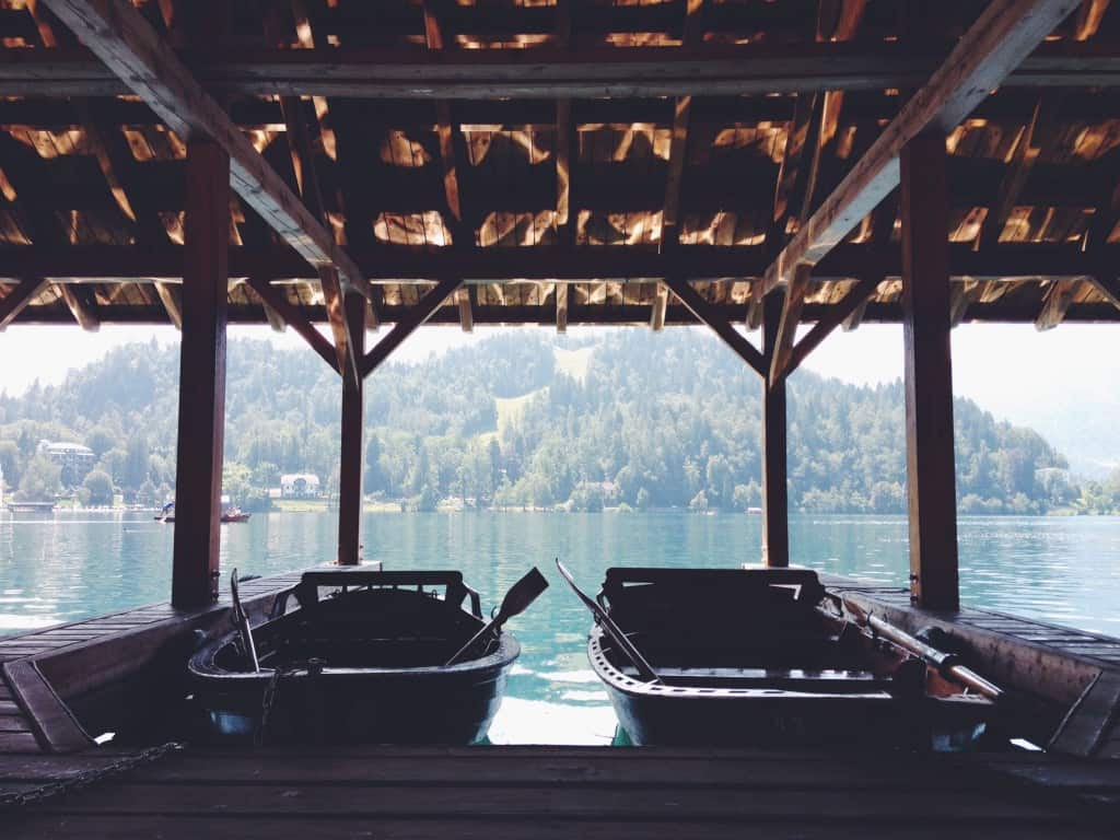 Two small boats under a cover at the dock, boating in Canada concept.