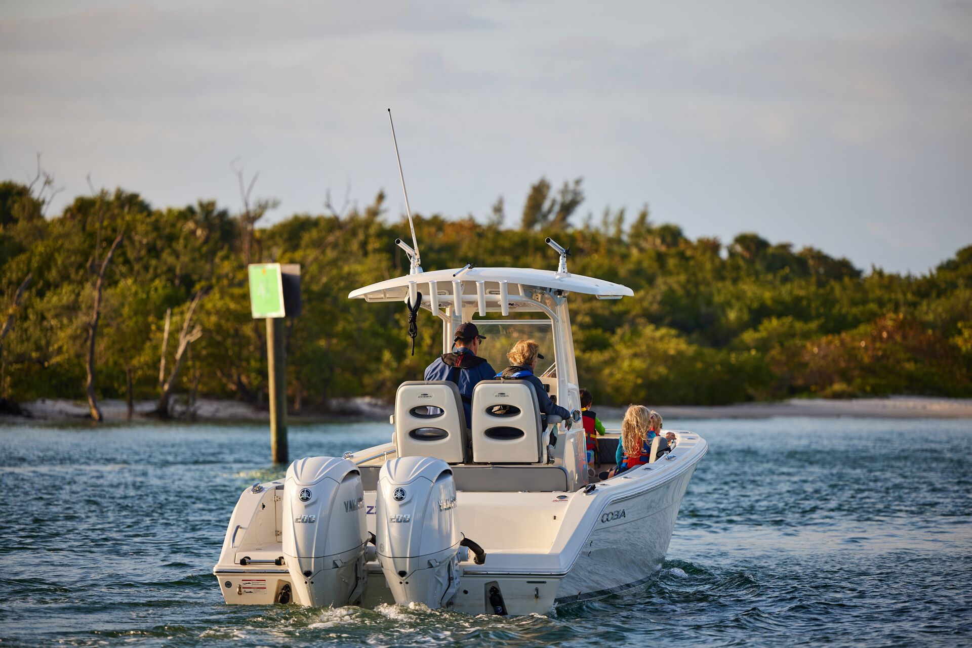 A few people enjoying a boat ride along the Florida Coast.