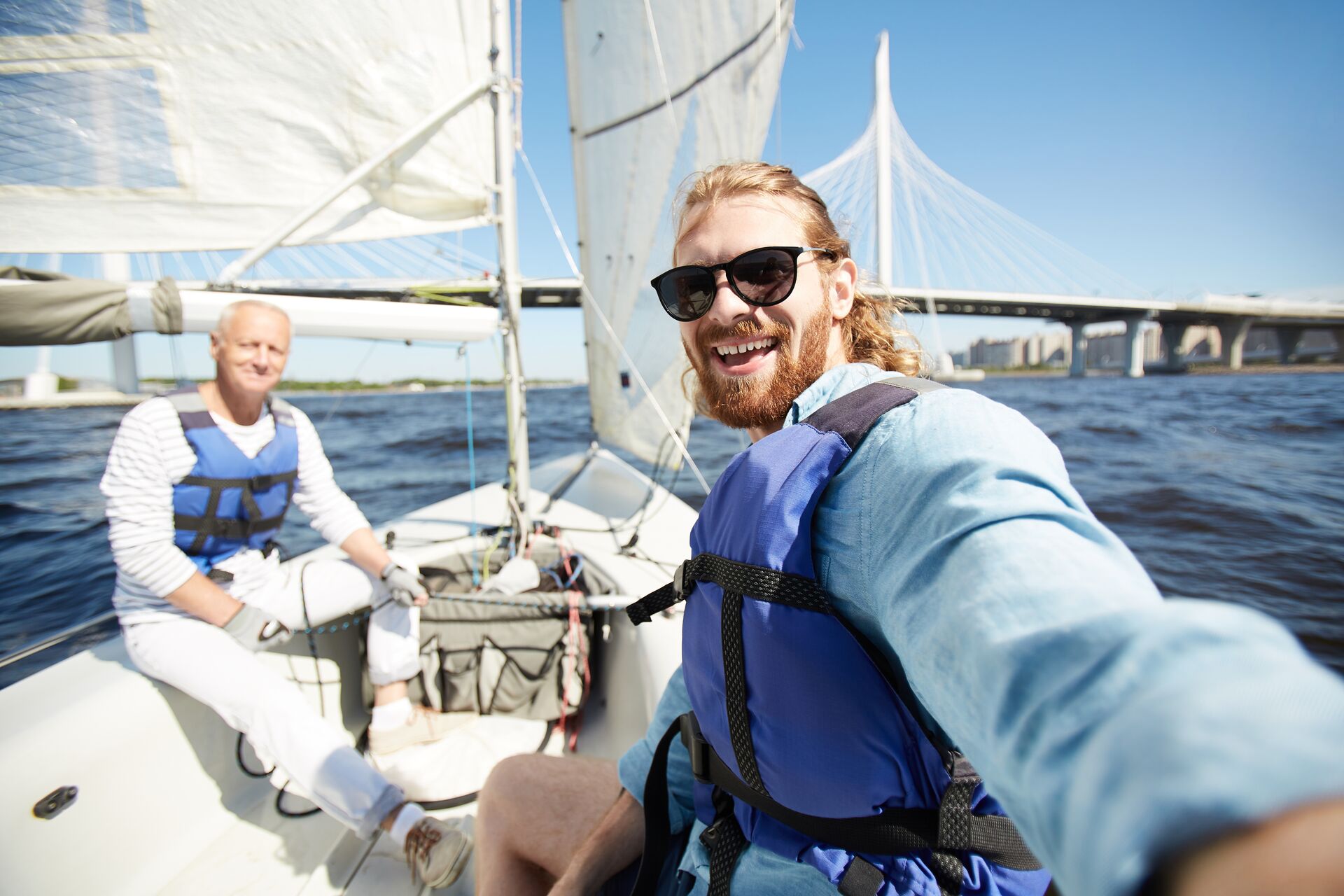 Two men on a sailboat.