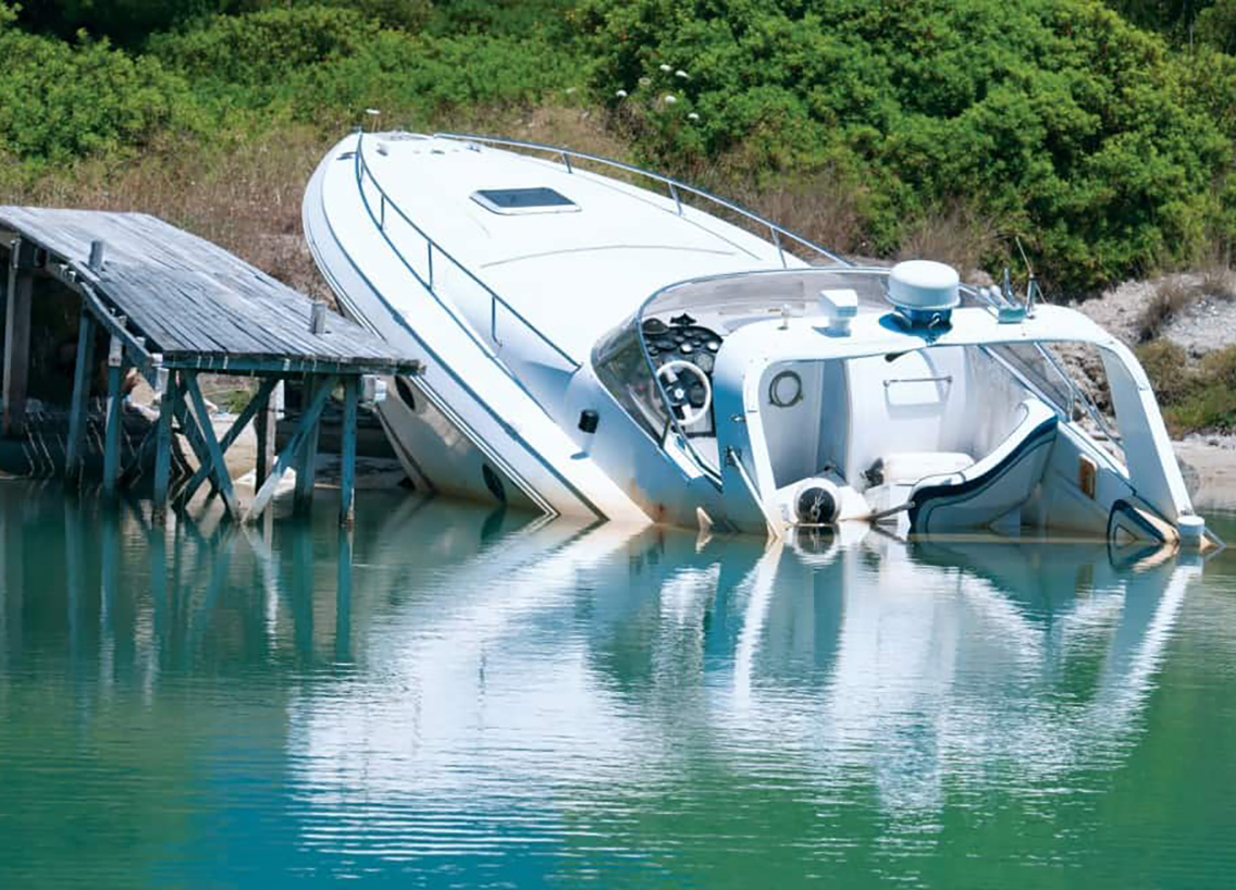 A boat on shore after an accident. 