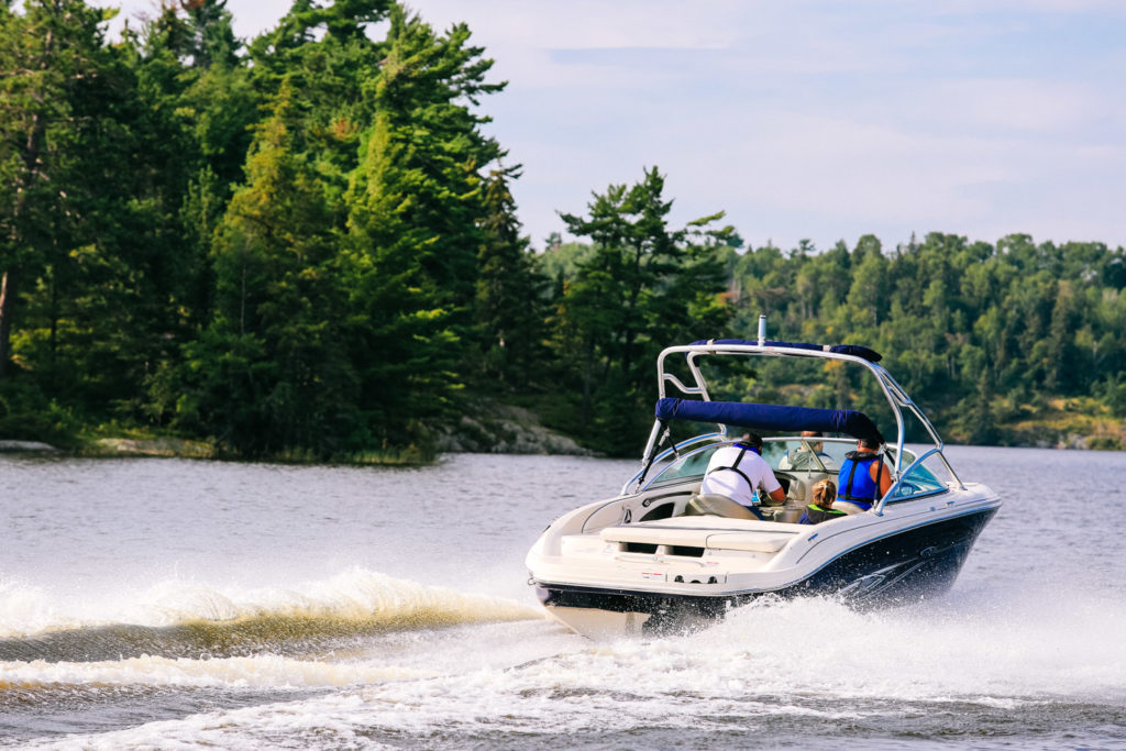 A family in a boat on the water. 