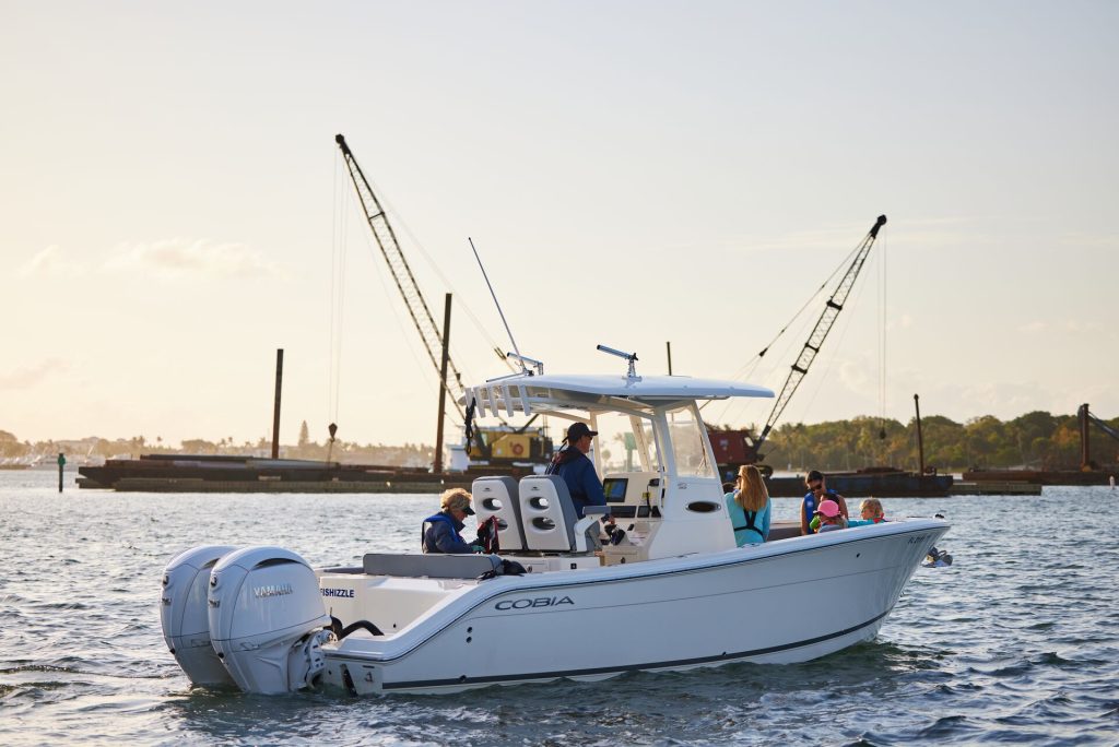 A boat full of boaters on the water, Saskatchewan boat registration concept.