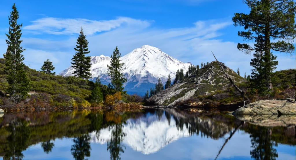 A mountain reflection on the water, boating in California concept.