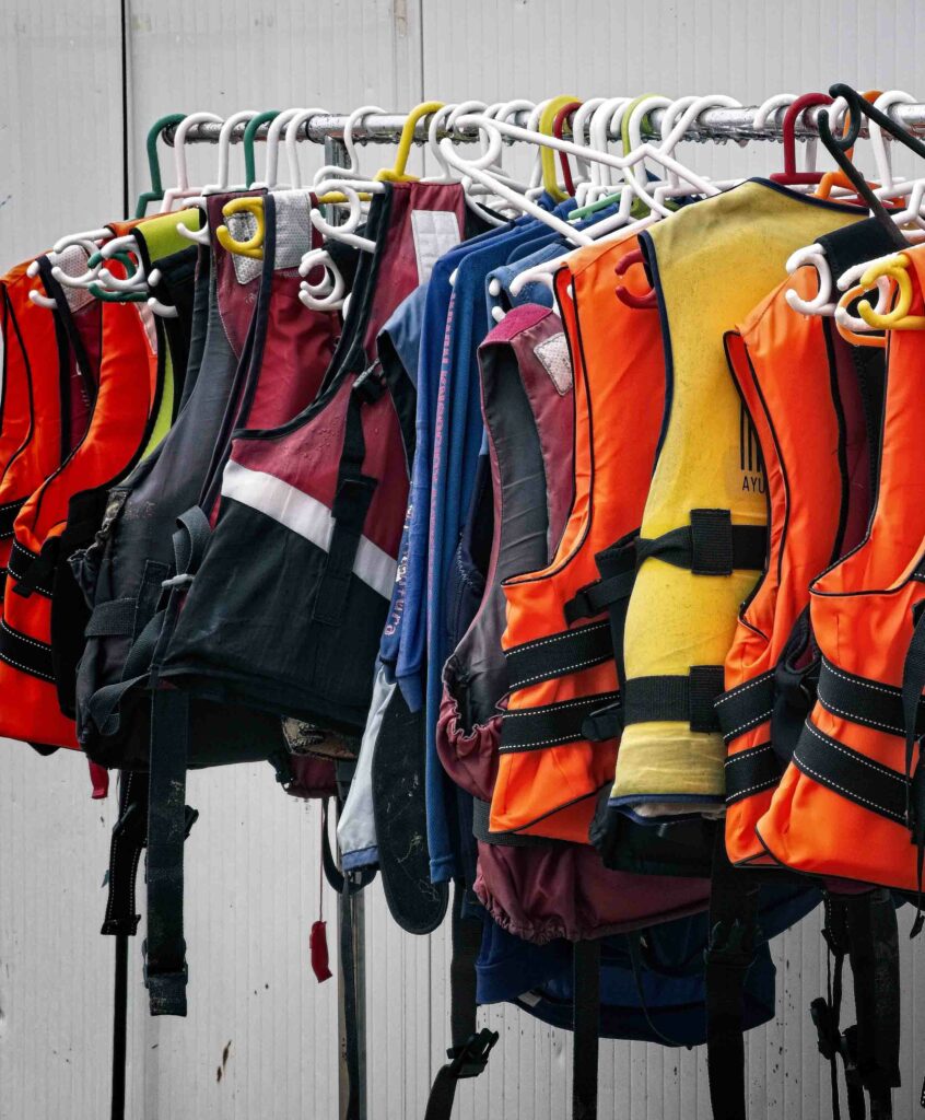 Lifejackets hang on a rack, things to check during the boating off-season concept. 