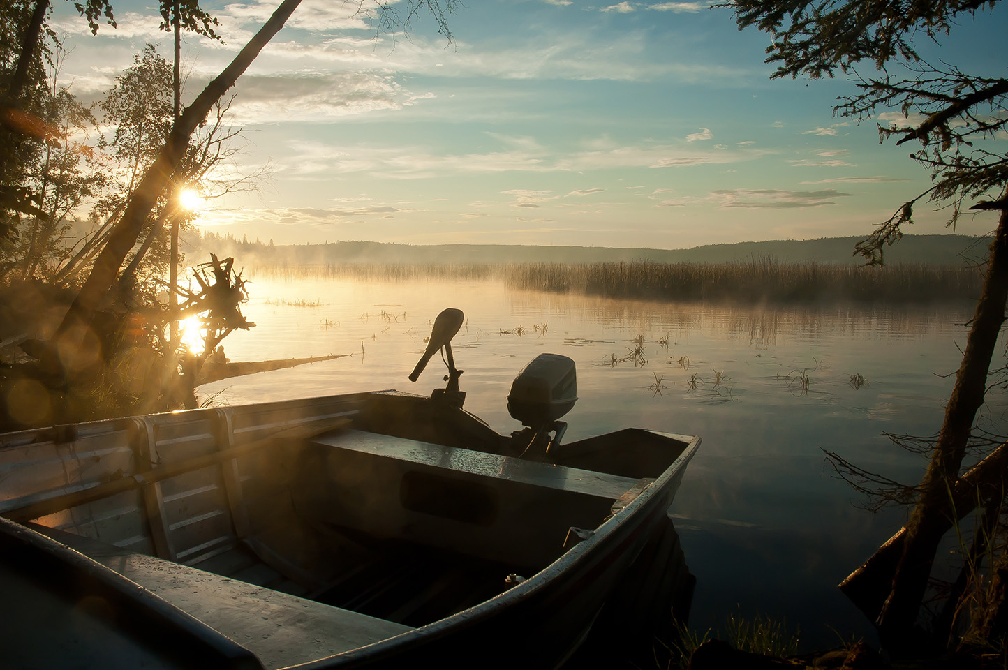 A small fishing boat on the water, boating in Alberta concept.