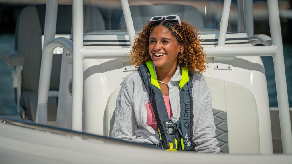 A woman wearing a life jacket on a boat, boat safely in Texas concept.
