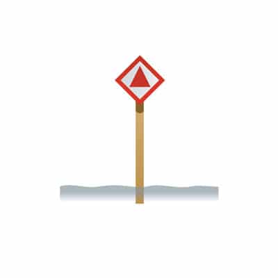 Diamond-shaped white sign with a red border and a red triangle, on a post in the water