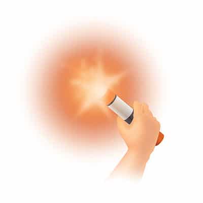 Hand holding a burning hand-held flare