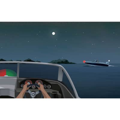 Night view from a boat's helm: another power boat ahead to the right, showing a red light
