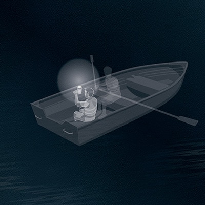 Rowboat at night with a person holding up a lit white lantern