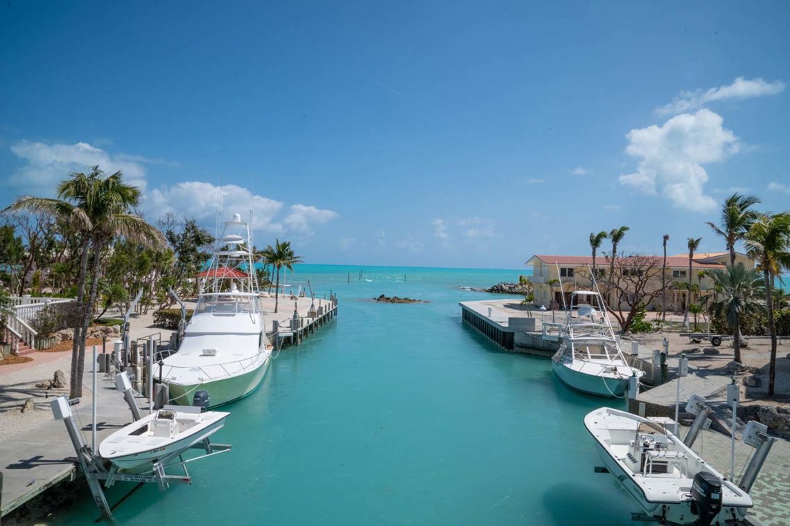 florida coast with moored boats along side of canal