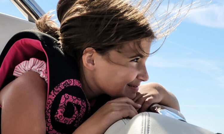 Child enjoying a boat ride